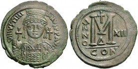 Justinian I, 527 – 565. Follis year XII (538-539), Æ 24.05 g. Helmeted, pearl-diademed and cuirassed bust facing, holding globus cruciger and ornament...