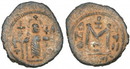Arab-Byzantine, fals, Dimashq, emperor enthroned holding sceptre and globus cruciger, palm-branch on T to left, ΛЄO to right, rev., large M with staur...