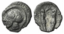 Sicily, Himera, c. 479-409 BC. AR Litra (8mm, 0.54g, 12h). Archaic head of Athena l., wearing crested helmet. R/ Pair of greaves. Gorini, Gruppo 18; H...