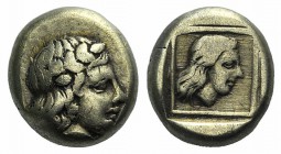 Lesbos, Mytilene, c. 412-378 BC. EL Hekte – Sixth Stater (9mm, 2.49g, 6h). Laureate head of Apollo r. R/ Head of female r. in linear square within inc...