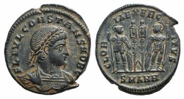 Constans (337-350). Æ Follis (17mm, 2.42g, 6h). Antioch, 335-7. Laureate and cuirassed bust r. R/ Two soldiers flanking two standards; SMANH. RIC VII ...