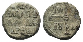 Byzantine PB Seal, c. 7th-11th century (23mm, 20.47g, 12h). Cruciform monogram. R/ Legend in four lines. VF