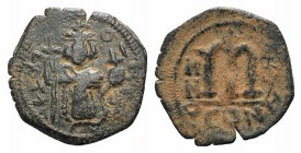 Islamic, Arab-Byzantine, c. 7th century. Æ Fals (20mm, 2.57g, 6h). Uncertain mint, c. 658-664. Emperor standing facing, holding long cross and globus ...