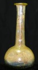 Romain - Grand flacon romain en verre irisé - 100 / 200 ap. J.-C.
Grand flacon romain en verre irisé doré. Le flacon contient encore de la terre et d...