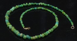 Romain - Collier en perles de silice - 100 / 300 ap. J.-C.
Très beau collier en perles de verre poli de couleur verte avec des nuances diverses et de...