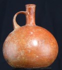 Précolombien - Equateur, culture Chorrera - Cruche - 1500 / 500 av. J.-C.
Cruche pansue à col court et petite anse, très belle engobe rouge carmin. A...
