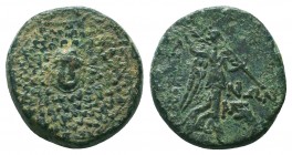 Komana (BC 85-65) AE 22
ca 85-65 BC. AE. Gorgoneion surrounded by aegis / ΚΟΜΑ-ΝΩΝ, Nik carrying palm leaf over shoulder; two monograms to right. Oliv...