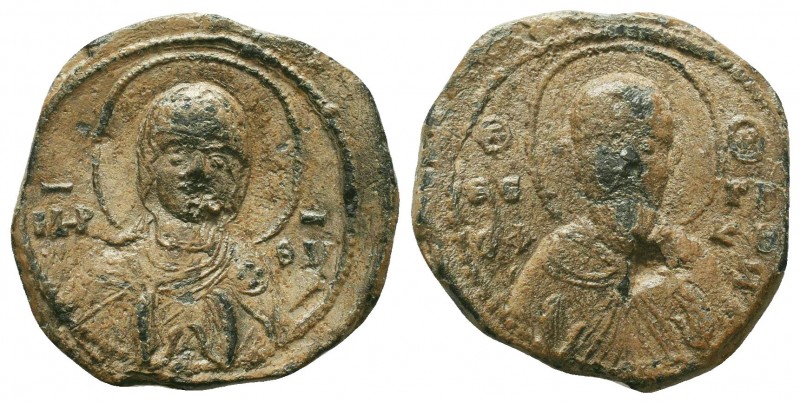 An iconographic byzantine lead seal, At right Ho hagios Theoph(ylaktos) ho k(tet...