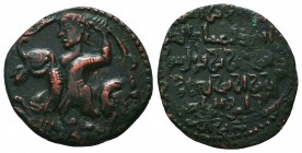 ARTUQID of KHARTPERT.mad al-Din Abu Bakr. AH 581-600 / AD 1185-1203.AE Dirhem No mint. Dated AH 582 (AD 1186/7). Figure, holding neck and tail, on dra...