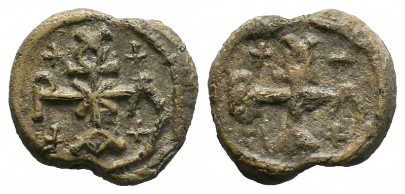 Byzantine lead seal of Vlatios (?) chartoularios
(6th/7th cent.)

Obverse: Cruci...