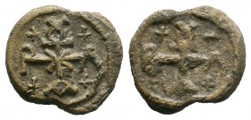 Byzantine lead seal of Vlatios (?) chartoularios
(6th/7th cent.)

Obverse: Cruciform monogram, inscribed in 4 corners by a cross: ΒΛΑΤΙΟΥ (?) = Βλατίο...