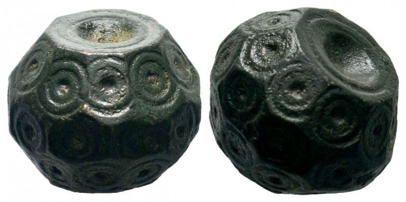 Byzantine bronze barrel weight with ring and dot motifs 11th-12th century AD

We...