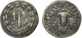LYDIA. Tralleis. Cistaphoric Didrachm (Circa 166-67 BC).
Obv: Club draped with lion skin; all within wreath.
Rev: Grape bunch within leaves. Controls:...