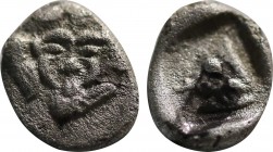 CARIA. Uncertain. Obol (5th century BC).
Obv: Facing gorgoneion, surrounded by four wings in tilted clockwise rotation.
Rev: Head of boar right within...