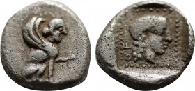 DYNASTS OF LYCIA. Uvug (Circa 470-440 BC). Obol. Uncertain mint. Obv: Sphinx seated right, raising forepaw. Rev: Female head right within pelleted squ...