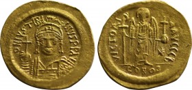 JUSTINIAN I (527-565). GOLD Solidus. Constantinople.
Obv: D N IVSTINIANVS P P AVG.
Helmeted and cuirassed bust facing, holding globus cruciger and shi...