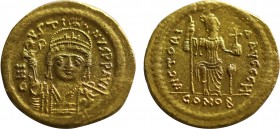 JUSTIN II (565-578). GOLD Solidus. Constantinople.
Obv: D N IVSTINVS P P AVG.
Helmeted and cuirassed bust facing, holding victoriola and shield decora...