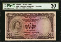 CEYLON. Central Bank. 100 Rupees, 1952-54. P-53a. PMG Very Fine 30.
Printed by BWC. Watermark of Chinze. QEII at left. Found with an ornate design an...