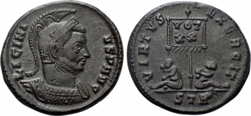 LICINIUS I (308-324). Follis. Treveri. 

Obv: LICINIVS P AVG. 
Helmeted and c...