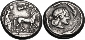 Sicily. Syracuse. Hieron I (478-466 BC). AR Tetradrachm, c. 478-475 BC. Charioteer driving quadriga right; above, Nike flying right, crowning horses. ...