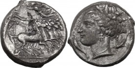 Punic Sicily. Uncertain mint. AR Tetradrachm, circa 340 BC. Quadriga right. Above, Nike flying left to crown charioteer, wearing long chiton. In exerg...