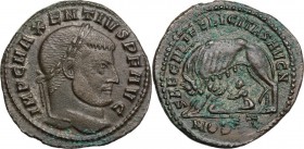 Maxentius (306-312). AE Follis, Ostia mint, early 310 AD. IMP C MAXENTIVS P F AVG. Laureate head right. / SAECVLI FELICITAS AVG N. She-wolf standing l...