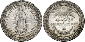 1803. Carlos IV. Virgen de Guadalupe. Medalla. (V.Q. 14153 var. fecha). 20,83 g. Ø35mm. Plata. Orlas de puntos y gráfilas vegetales. Leves golpecitos....