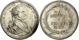 1806. Carlos IV. Premio al Mérito y la Fidelidad. Medalla. (Medina Col. 39) (Grohe C-283). 89 g. Ø61 mm. Bronce plateado. Grabador: F. Gordillo. Impur...