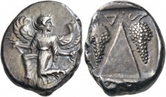 CARIA. Kaunos. Circa 430-410 BC. Stater (Silver, 23 mm, 11.70 g, 12 h). Winged female goddess moving to left, her head turned back to right, holding a...