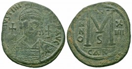 JUSTINIAN I.527-565 AD.Carthage Mint. AE Follis

Obverse : D N IVSTINIANVS P P AVG; Helmeted and cuirassed bust facing, holding globus cruciger and sh...