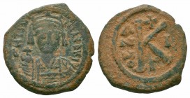 MAURICE TIBERIUS.582-602 AD.Constantinople Mint.AE half follis

Obverse : D N mAVRICI TIbER P P AV; helmeted and cuirassed bust of Maurice Tiberius fa...