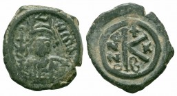 MAURICE TIBERIUS.582-602 AD.Constantinople Mint.AE half follis

Obverse : D N mAVRICI TIbER P P AV; helmeted and cuirassed bust of Maurice Tiberius fa...