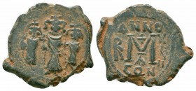 HERACLIUS.HERACLIUS CONSTANTINE and MARTINA. 610-641 AD.Constantinople Mint. AE Follis

Obverse : Heraclius, in center, flanked by Martina, on left, a...