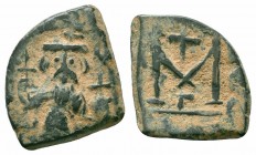 CONSTANS II. 641-668 AD.Constantinople Mint.AE Follis

Obverse : Constans standing facing, holding long cross and globus cruciger
Reverse : Large M; c...