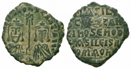 BASIL I & CONSTANTINE.867-886 AD.Constantinople Mint.AE Follis

Obverse : ЬASILIOS S COҺST AЧGG; Crowned facing busts of Basil and Constantine, holdin...