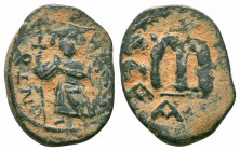UMAYYAD CALIPHATE.Pseudo Byzantine Type.Imitating the Types of Constans II.Circa 647-670 AD.AE Fals

Obverse : CѠT૪TO NIKA; standing Imperial figure h...