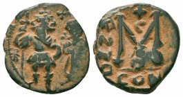 UMAYYAD CALIPHATE.Pseudo Byzantine Type.Imitating the Types of Constans II.C irca 647-670 AD.AE Fals

Obverse : Two Standing Figures
Reverse : Large M...