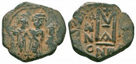 UMAYYAD CALIPHATE.Pseudo Byzantine Type.Imitating the Types of Constans II.Circa 647-670 AD.AE Fals

Obverse : Three standing figures
Reverse : Large ...