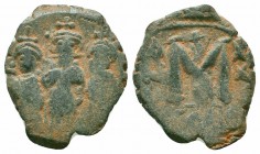 UMAYYAD CALIPHATE.Pseudo Byzantine Type.Imitating the Types of Constans II.Circa 647-670 AD.AE Fals

Obverse : Three Standing Figures
Reverse : Large ...