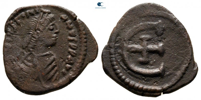 Justinian I AD 527-565. Theoupolis (Antioch)
Pentanummium Æ

16 mm., 2,15 g....