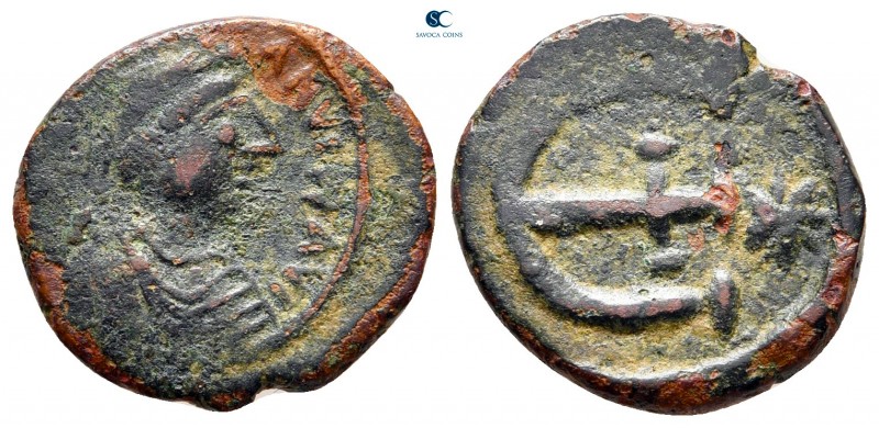 Justinian I AD 527-565. Theoupolis (Antioch)
Pentanummium Æ

17 mm., 2,17 g....