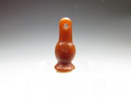 Egyptian carnelian amulet in the shape of a poppy bead, New Kingdom, 14 mm