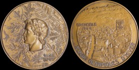 FRANCE: 1968 Winter Olympics Grenoble Participation Medal in bronze. Obv: Greek style head of an athlete with elaborate snowflakes behind. Rev: Citysc...