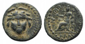 Lycaonia, Eikonion, c. 1st-2nd century AD. Æ (13mm, 2.28g, 12h). Facing gorgoneion. R/ Female seated l., holding patera. von Aulock, Lykaonien 252; SN...