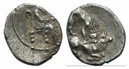 Cilicia, Myriandros, 4th century BC. AR Obol (8.5mm, 0.60g, 3h). King of Persia seated r., holding lotus-tipped sceptre and lotus flower. R/ Lion atta...