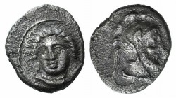 Cilicia, Tarsos. Time of Pharnabazos and Datames, c. 380-361/0 BC. AR Obol (8mm, 0.64g, 6h). Female head facing slightly l. R/ Helmeted and bearded ma...