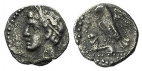 Cilicia, Uncertain, c. 4th century BC. AR Obol (9mm, 0.66g, 12h). Male head l., wearing wreath of grain ears. R/ Eagle standing l., spreading wings, o...