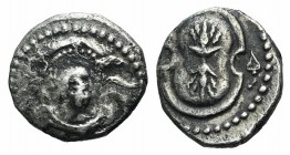 Cilicia, Uncertain, 4th century BC. AR Obol (9mm, 0.68g, 3h). Helmeted head of Athena facing slightly l. R/ Shield ornamented with thunderbolt; ivy le...