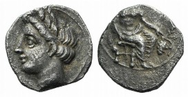 Cilicia, Uncertain, 4th century BC. AR Obol (8.5mm, 0.62g, 3h). Baaltars seated r., holding sceptre, grain ear, and grape bunch. R/ Head of female l. ...