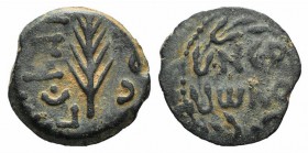 Judaea, Procurators. Porcius Festus (59-62 CE). Æ Prutah (14mm, 1.73g, 11h). Jerusalem, year 5 of Nero (58/9). Blundered legend within wreath. R/ Palm...